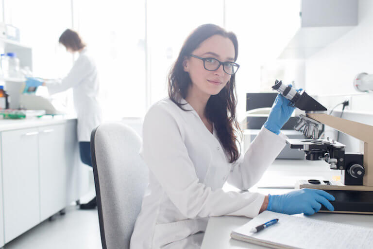 Woman working with microscope